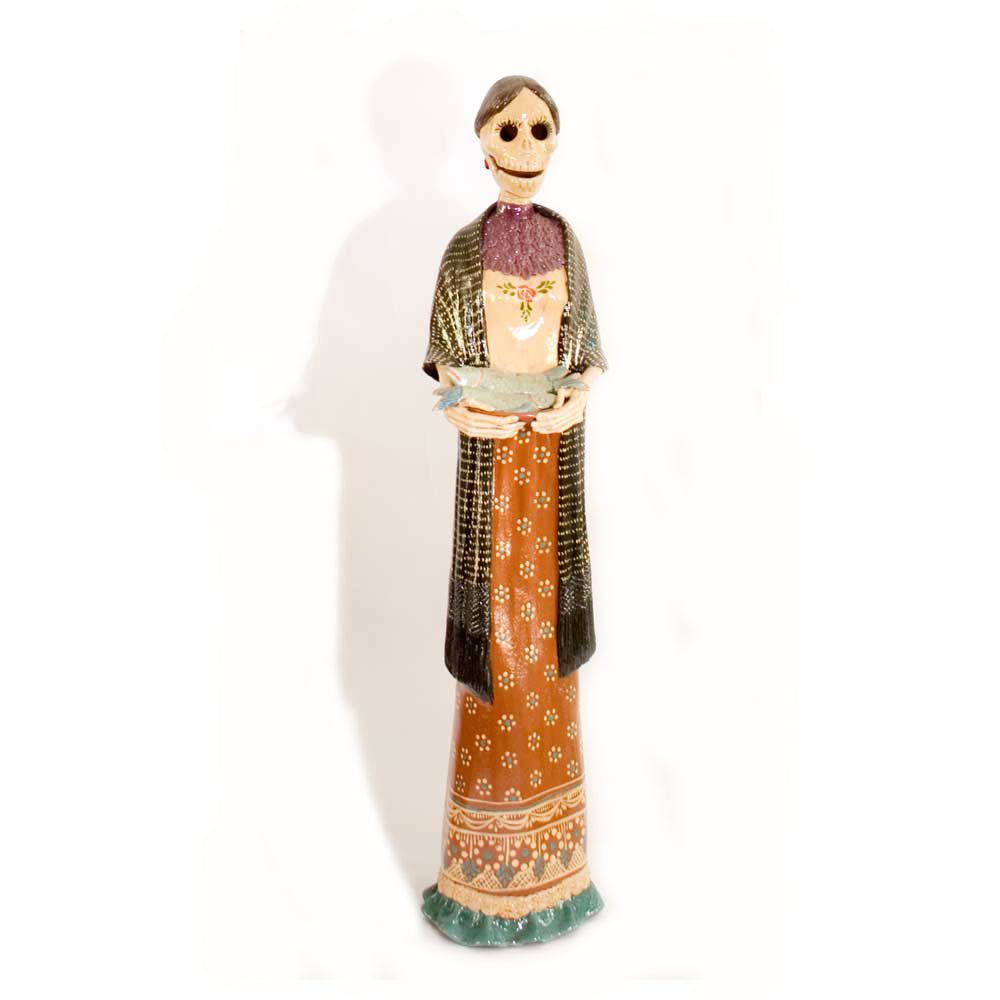 Terracotta figure - lady skeleton holding a bowl