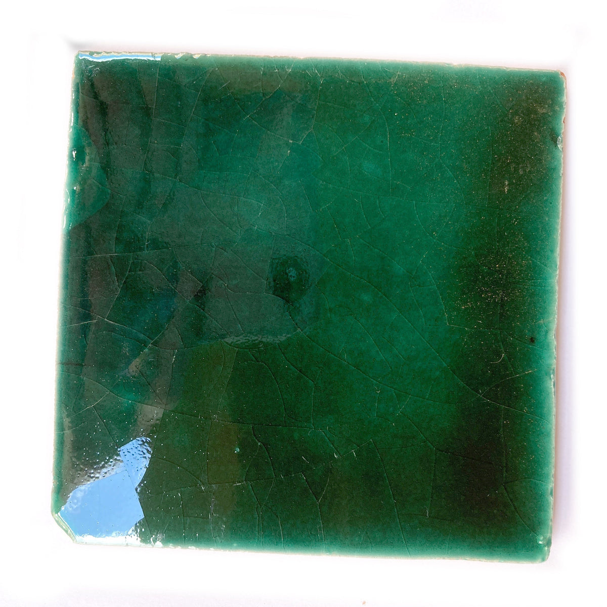  a tile showing the crackle inherent with hand made tiles